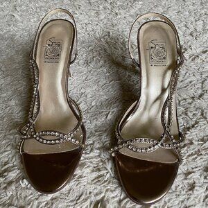 Brand new, never worn gold and rhinestone heels